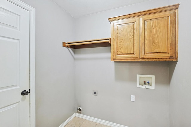 laundry area with cabinets, hookup for an electric dryer, hookup for a washing machine, and light tile patterned floors