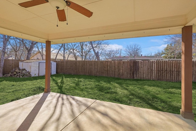 view of patio featuring ceiling fan and a storage unit