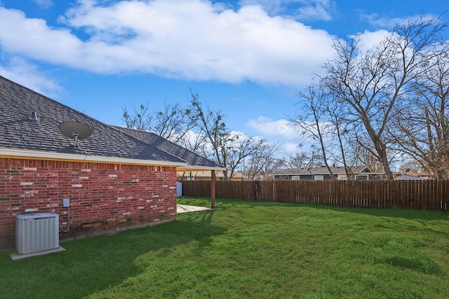 view of yard featuring central air condition unit