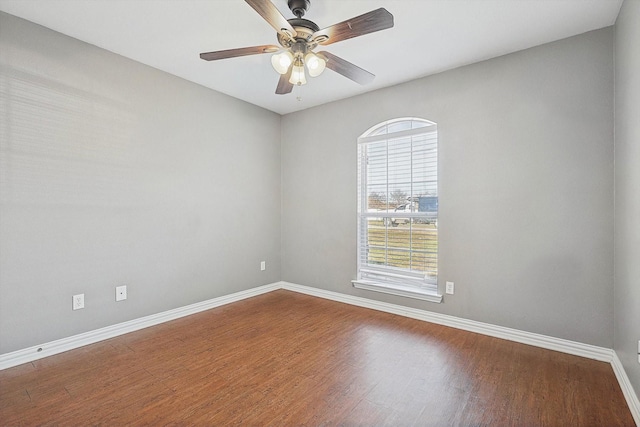 empty room featuring hardwood / wood-style flooring and ceiling fan