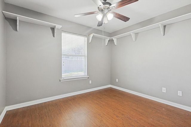 walk in closet featuring hardwood / wood-style flooring and ceiling fan