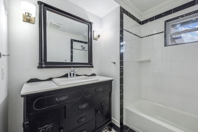 bathroom featuring crown molding, vanity, and tiled shower / bath combo