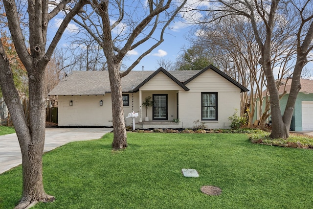 ranch-style home with a garage, a porch, and a front lawn