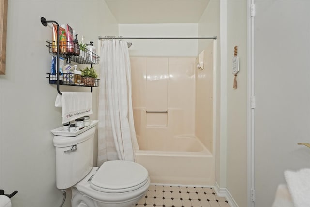 bathroom featuring toilet and shower / bath combo