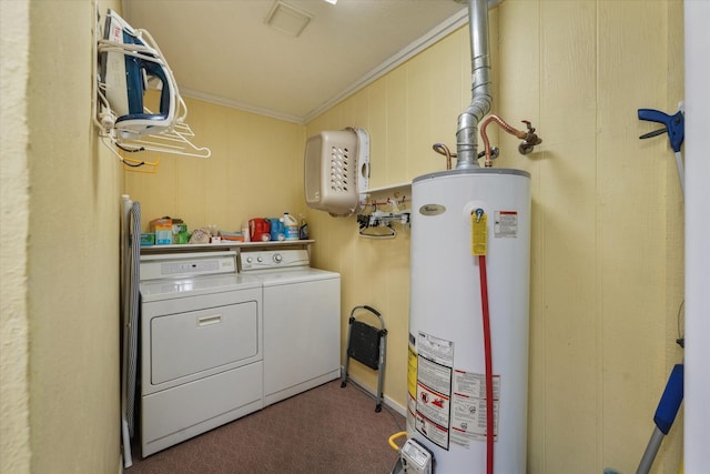 laundry area featuring washer and dryer, dark carpet, crown molding, and water heater