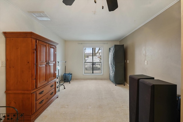 miscellaneous room with ornamental molding, light colored carpet, and ceiling fan