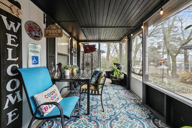 sunroom with wooden ceiling