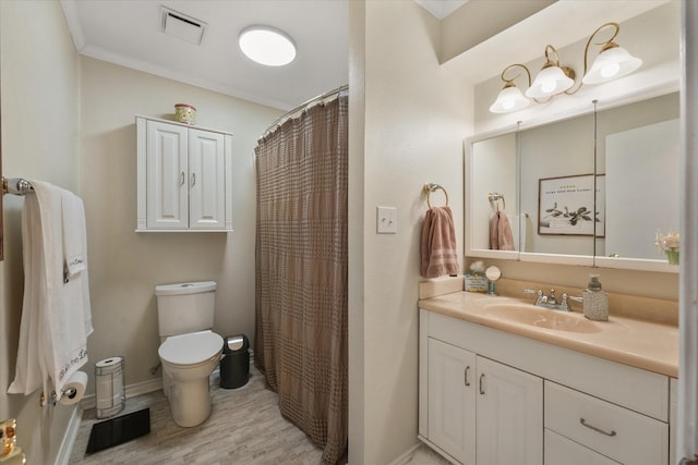 bathroom featuring walk in shower, vanity, toilet, and wood-type flooring