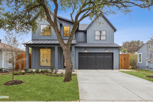 modern farmhouse featuring a garage and a front yard