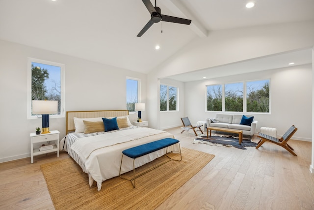 bedroom featuring lofted ceiling with beams, ceiling fan, and light hardwood / wood-style flooring