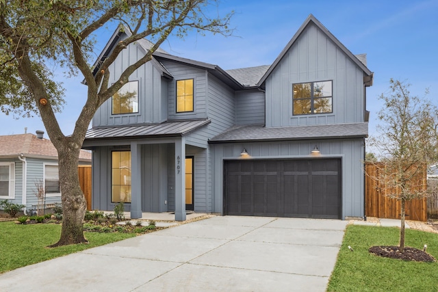 modern farmhouse style home with a garage and a front lawn