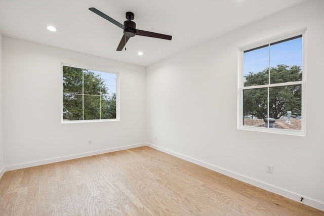 unfurnished room featuring light hardwood / wood-style floors and ceiling fan