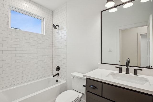 full bathroom featuring vanity, toilet, and tiled shower / bath combo