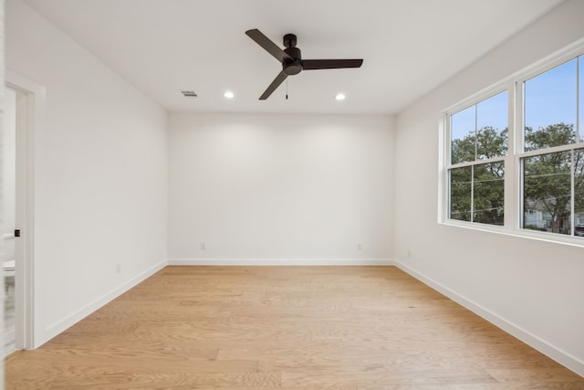 spare room featuring ceiling fan and light wood-type flooring