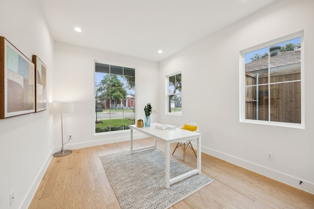 office space with light hardwood / wood-style flooring