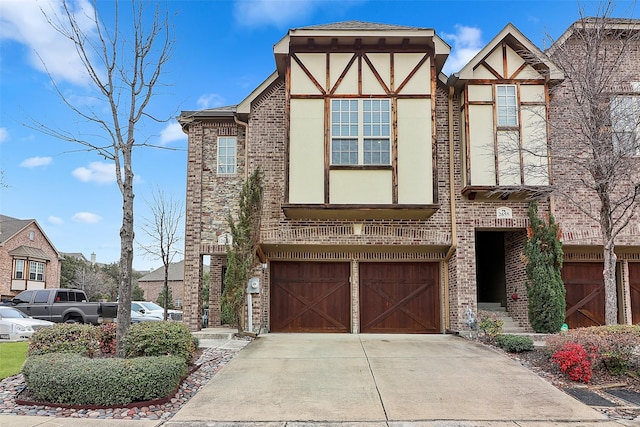 tudor-style house with a garage