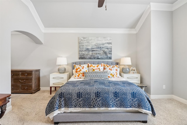 carpeted bedroom featuring ornamental molding and ceiling fan