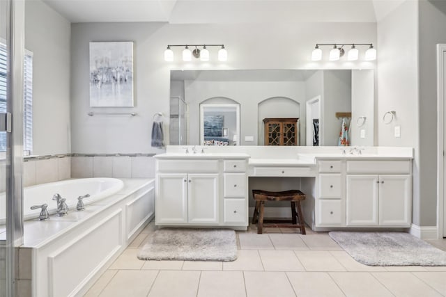 bathroom featuring vanity, tile patterned flooring, and plus walk in shower