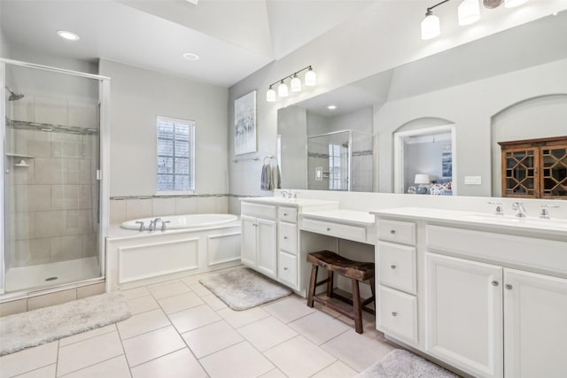 bathroom with vanity, tile patterned flooring, and independent shower and bath