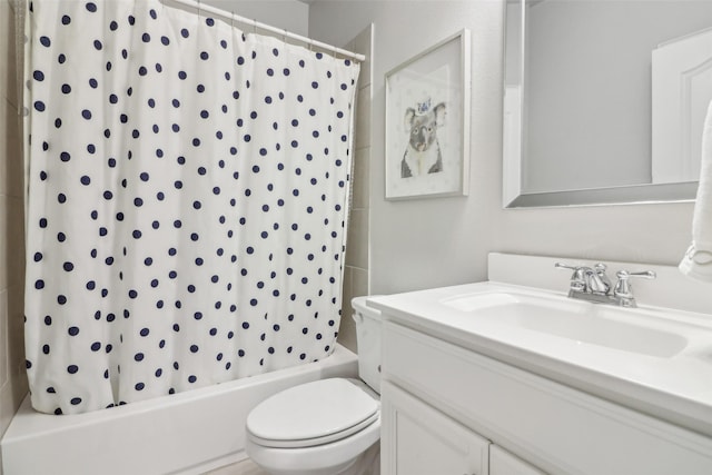 full bathroom featuring vanity, toilet, and shower / bath combo with shower curtain