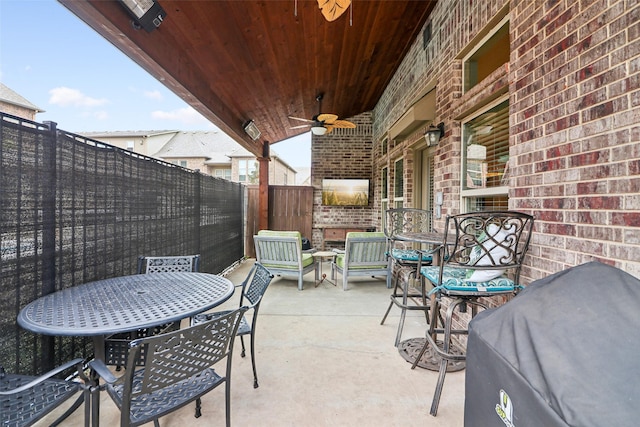 view of patio / terrace with area for grilling and ceiling fan