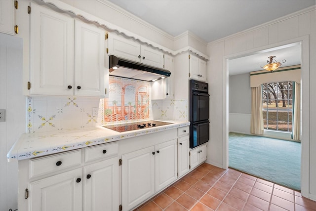 kitchen with white cabinetry, crown molding, light carpet, and black appliances