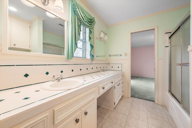 bathroom with tasteful backsplash, shower / bath combination with glass door, tile patterned flooring, vanity, and crown molding