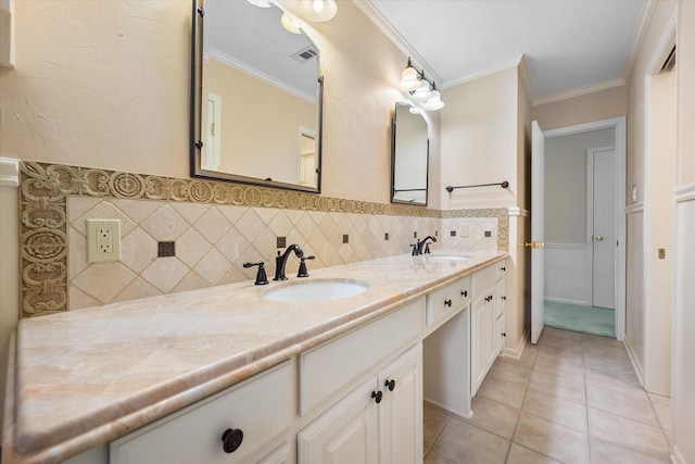 bathroom featuring vanity, tile patterned flooring, ornamental molding, and decorative backsplash