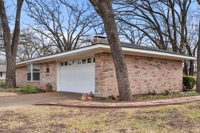 view of side of home with a garage