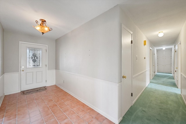 view of carpeted foyer