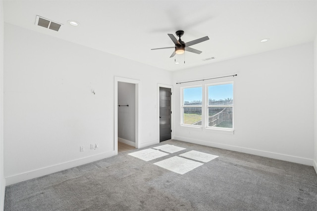 unfurnished bedroom featuring light colored carpet and ceiling fan