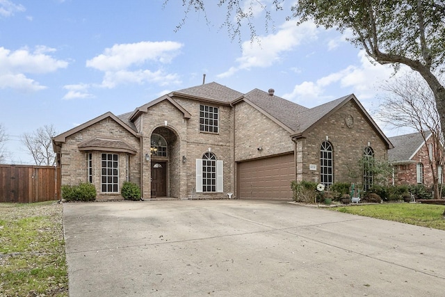 french country home with a garage