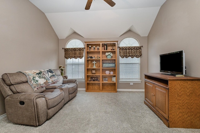 carpeted living room featuring vaulted ceiling and ceiling fan