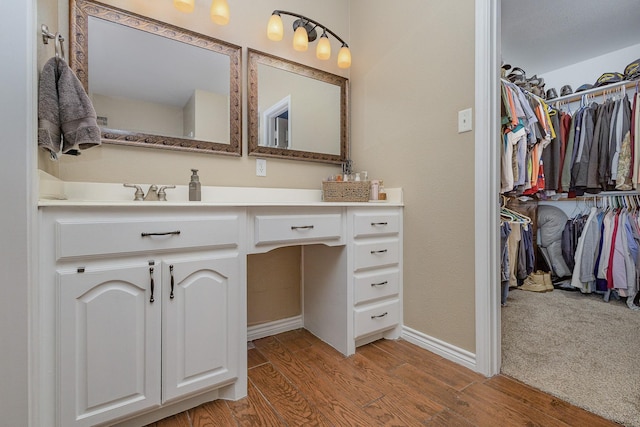 bathroom with wood-type flooring and vanity