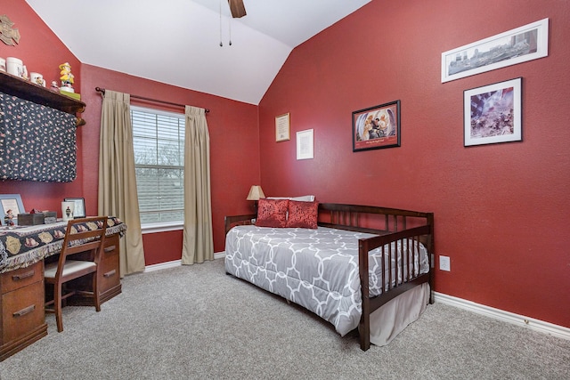 bedroom featuring vaulted ceiling, light colored carpet, and ceiling fan