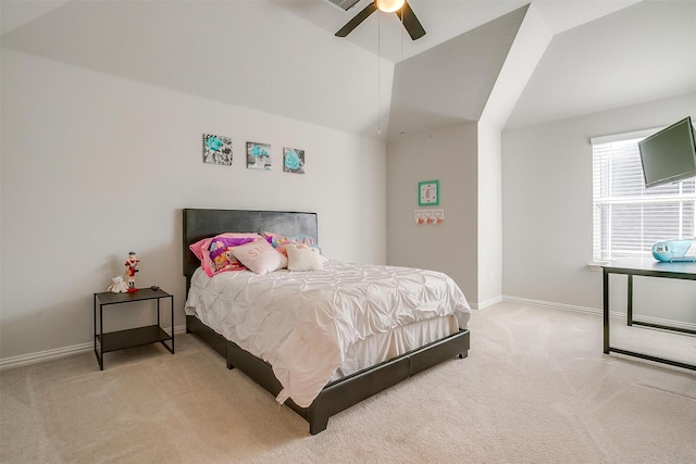 bedroom with light carpet, vaulted ceiling, and ceiling fan