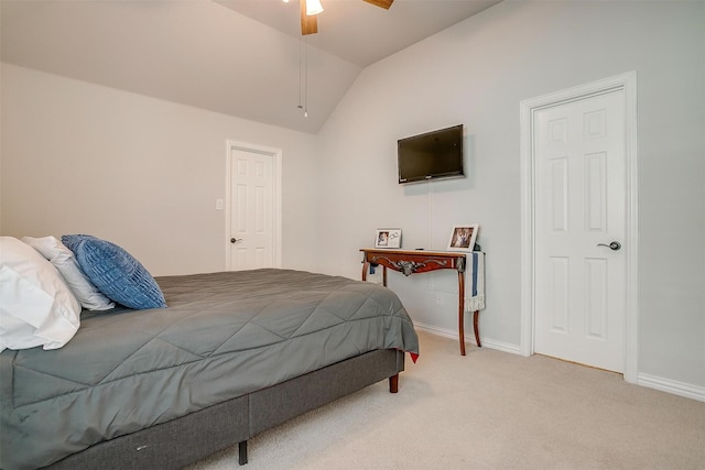 bedroom with vaulted ceiling, carpet flooring, and ceiling fan