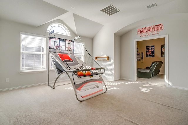 recreation room featuring lofted ceiling and carpet floors