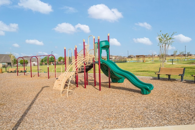 view of jungle gym featuring a lawn