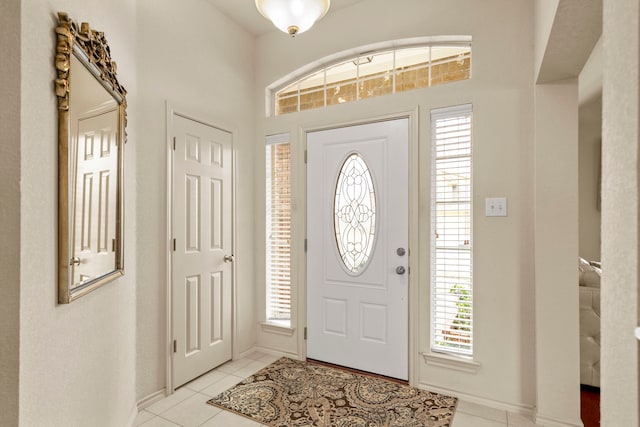 foyer featuring light tile patterned floors