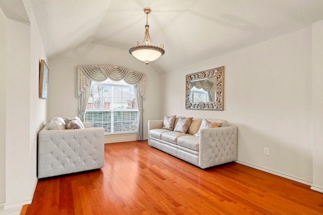 living room with lofted ceiling and hardwood / wood-style floors