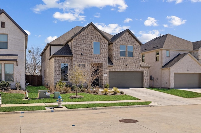 view of front of property featuring a garage and a front yard