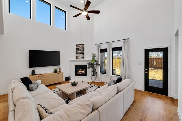 2500 Clearspring Dr, Celina, TX 75009 - living room featuring a towering ceiling, light hardwood / wood-style flooring, and ceiling fan