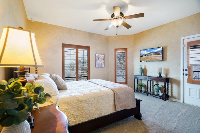 carpeted bedroom with ceiling fan