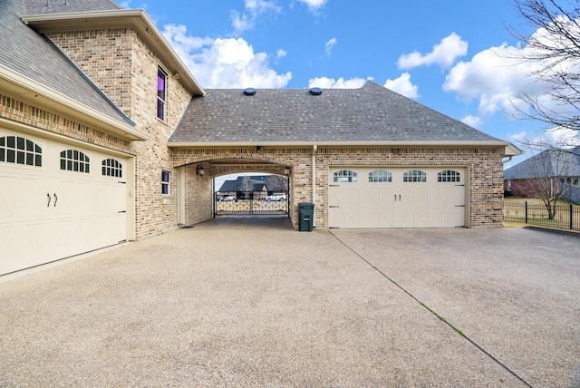 view of side of property with a garage