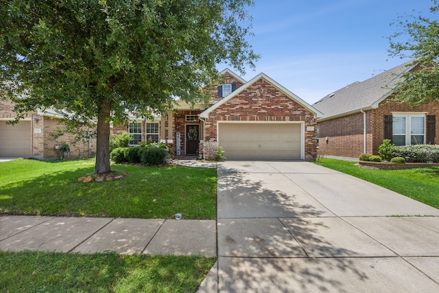 view of front of property featuring a garage and a front yard