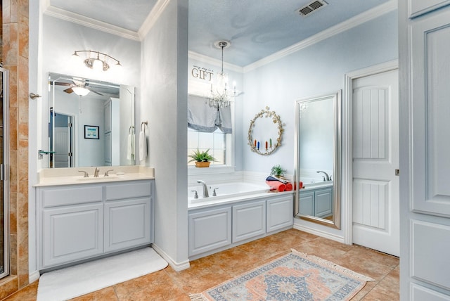 bathroom with tile patterned flooring, ornamental molding, and vanity