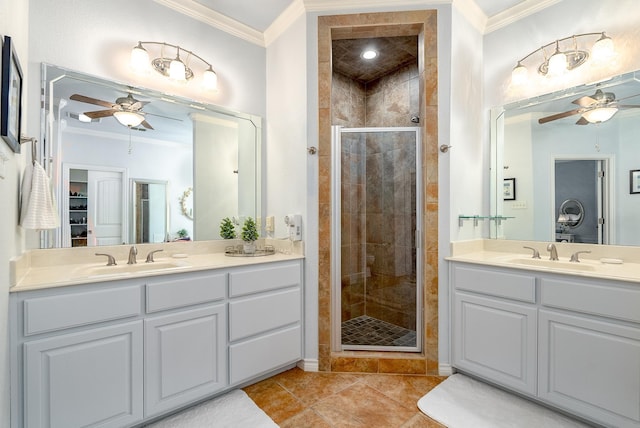 bathroom featuring an enclosed shower, tile patterned floors, ornamental molding, and ceiling fan