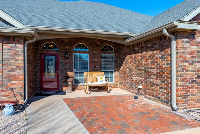 entrance to property featuring a patio area