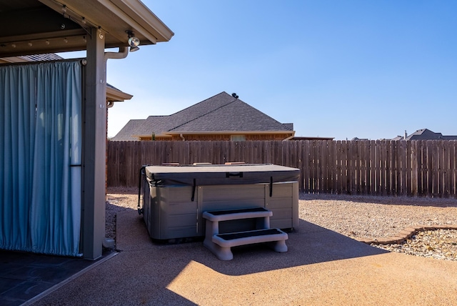 view of yard featuring a hot tub and a patio